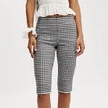 Detail of high waist plaid cropped pants with white lace trim and slim fit design - S / Black