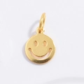 Close-up of golden S925 silver round smiley face pendant with hollow design and ring loop - Gold Smile Face Pendant