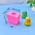 Macro detail of snowman silicone mold showing product dimensions and finished 3D soap models - Snowman