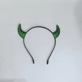 Detail of green sequined devil horns headband with a black plastic band for Halloween - Green Glitter Small Horn