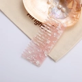 Detail of pink marble acetate wide-tooth comb showing smooth texture and shell-like finish - 8# Pink Marble