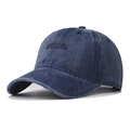 Close-up of embossed black HELLO letters on washed navy denim cotton baseball cap - Navy Blue