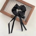 Elegant black silk scrunchie with long ribbon tassels on a vintage wooden display frame - FQ1069A Black