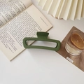 Close-up of matte dark green rectangular hair claw clip on a minimalist lifestyle background - Matte Large Square Green