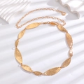 Detail of golden bohemian waist chain featuring hammered olive leaf metallic plates - Gold (Olive Leaf Hammered)
