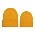 Detail of mustard yellow rib-knit beanies showing fine texture in adult and kid sizes - Ginger Yellow