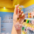 Glinsterende sterren sleutelhanger met gekleurde strass en gouden sluiting in hand - Roze Multi