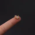 Delicate gold crown cartilage earring with marquise cubic zirconia on a fingertip - Gold Crown Marquise CZ Style (354-7#G)