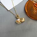 Elegant gold titanium necklace featuring a double scallop pendant with pearl and zircon inlay - Shell Pearl-Gold 0369J