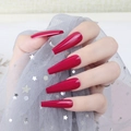 Macro shot of long coffin-shaped deep red glossy press-on nails with sequin mesh background - Dark Red (CBLL-34)