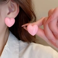 Detail view of pink heart stud earrings worn and held to show high gloss resin finish - 14# Pink Glossy 3D Heart Stud Earrings (Silver Pin)