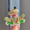 Detail of frog brooch with colorful crystals and green enamel on a gold-plated base - Gold Base Olive Yellow Green Cartoon Frog
