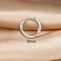 Close-up of 9mm minimalist silver hoop earring on champagne silk background - 1PC / 9mm / Silver