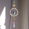 Garden suncatcher with gold sun, moon charms and rainbow crystal prisms hanging decor - Amazonite