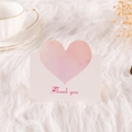 Greeting card with pink watercolor heart and Thank You text on soft white fur background - Thank You (Light Pink)