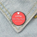 Red metal teaching brooch badge with TEACHING Fills My Heart text on denim background - Teaching Fills My Heart Style (XZ59)