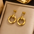 Close-up of golden U-shaped hollow earrings in a luxury jewelry display box - Gold Simple Hoop (E-359)