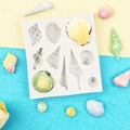 White silicone mold with 9 shell cavities for ocean themed fondant cake decorating - 50-65-B Shell & Conch Multi-Mold / Gray