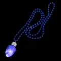 Blue LED light bulb pendant necklace with matching blue bead chain on black background - Blue Bulb Bead Necklace