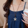 Detail view of starfish pendant with wooden bead on brown leather necklace - 34# Necklace-Coffee