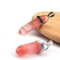 Polished red natural crystal hexagonal column pendant with silver metal bail on wood - Watermelon red