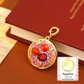 Vintage Aquarius pendant with pink enamel, red beads, and star motifs on gold finish - Aquarius Style