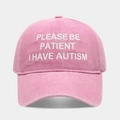 Close-up of pink washed cotton baseball cap featuring white embroidered slogan text - Adjustable / Pink