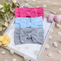 Three-pack of soft knit nylon baby headbands with large bows in pink, blue, and gray colors - 3-Pack / Rose Pink Blue Gray
