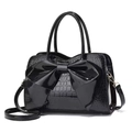 Fashionable black faux leather handbag with oversized bow and stylish stone texture - Black
