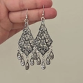 Detailed close-up of vintage silver hollow flower earrings with teardrop pendants - 9# Ear Hook-Silver-Vintage Hollow Pendant