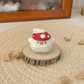 Handcrafted wooden bird figurine wearing a red mushroom hat on a natural wood base - Mushroom Hat Tuan Tuan with Wings (Small) / Height approx 4cm