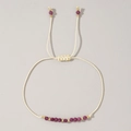 Bracciale fatto a mano regolabile con pietre preziose viola e perline dorate - Luglio-Rubino