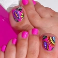 Pink press-on toenails with vibrant paisley and floral patterns for a French pedicure look - FW22