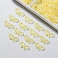 Close-up of pale yellow pearl bow tie beads for DIY crafts and phone case decoration - 1x1.8cm / Yellow