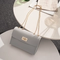 Chic light gray flap bag with gold chain strap and rectangular lock in a stylish setting - Light Gray