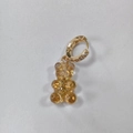 Gold huggie hoop earrings with amber resin gummy bear and sparkling glitter details - Back Starry Yellow