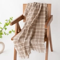 Classic beige plaid scarf with soft fringe draping over a wooden chair in soft light - Off White