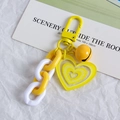Cute yellow and white double heart chain keychain with a metal bell and spring clasp - Yellow