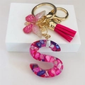 Resin initial S keychain with pink tassel and gold butterfly charm on white pedestal - Rose Red Butterfly Tassel Clip / S