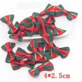 Detailed view of red and green striped Christmas bows with gold trim, size 4x2.5cm - 2.5*4cm Christmas Style 1