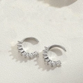 Detailed macro view of silver C-shaped ear cuffs with rectangular zircon stones - Baguette Zirconia Row Set / Silver White Zirconia