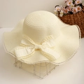 Cream straw sun hat with wide wavy lace brim and a large satin bow for summer beach - One Size / White