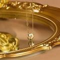 Macro detail of gold C-shaped pendant with diamonds and NEW YORK engraving on the side - Gold C-Shape NEW YORK Engraved Pendant