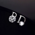 Detailed macro view of asymmetric D-shaped silver earrings with sparkling zircon stones - Silver Asymmetric Letter D Zirconia Style (A34 Silver)