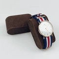 Classic gold watch with blue white red nylon strap on brown velvet display pillow - Coffee Bead Velvet Watch Pillow