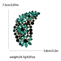 Vintage olive green crystal floral brooch with measurements 7.3cm height and 5.8cm width - Green