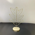 Elegant gold leaf metal jewelry display stand for necklaces and rings on black surface - Gold Leaf Jewelry Tree