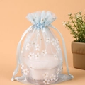 Light blue floral organza drawstring bag with white flower patterns and golden glitter - 13*18cm / Blue