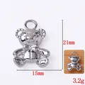 Teddy bear shaped metal pendant in silver finish with bow detail and 21x15mm dimensions - Bear / Silver Bear