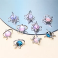 Macro detail of planet and moon charms with colorful gemstones and sparkling zircon accents - Style 15-Planet Moon Combo